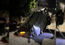 Caminhão de lixo é engolido por buraco no meio da rua